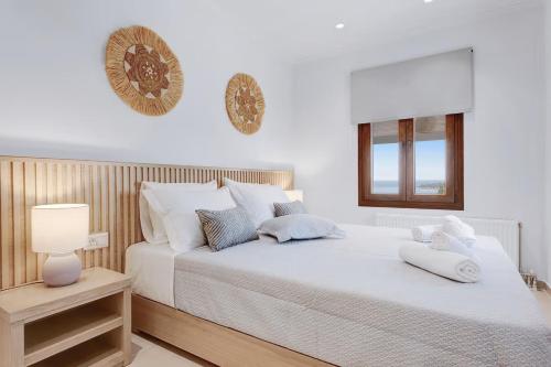 Ένα ή περισσότερα κρεβάτια σε δωμάτιο στο Olivella Luxury Suites