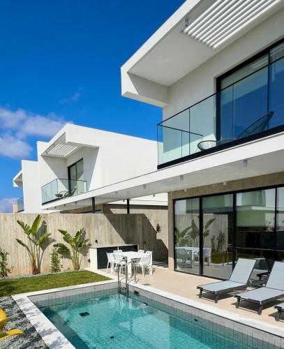 an image of a house with a swimming pool at Elysian Blue villa 2 in Paphos