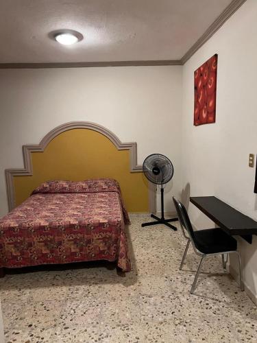 Ένα ή περισσότερα κρεβάτια σε δωμάτιο στο Hotel y Restaurant Real Plaza Jacona