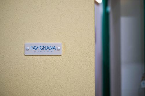 a sign on a wall that says familia navagi at ISLAVENTO case vacanza Trapani in Trapani