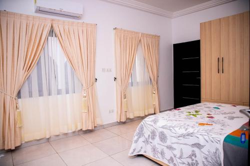 Ένα ή περισσότερα κρεβάτια σε δωμάτιο στο Golden Hayat Suites
