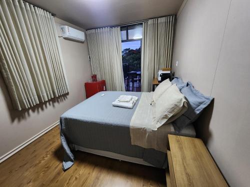 Postel nebo postele na pokoji v ubytování Pousada Vilas Boas - Suíte Casal 2