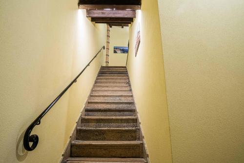 a stairway in a building with a stair railing at ISLAVENTO case vacanza Trapani in Trapani