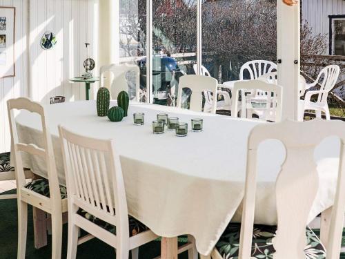 a white table and chairs in a room at 4 star holiday home in SKÅNE VEJBYSTRAND in Vejbystrand