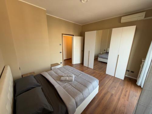 a bedroom with a large bed in a room at SkyLoft Bergamo - Attico Chic con Panorama Unico in Bergamo