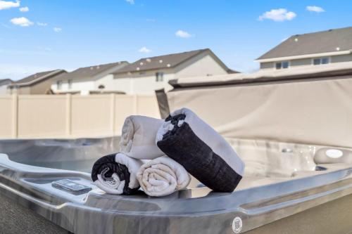 a bed in the back of a truck with towels at Spacious 6BR - Sleeps 22 - Game Room & Pool Access in Meridian