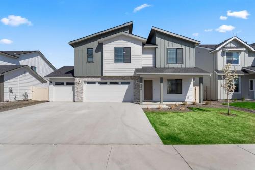 a house with a driveway in front of it at Spacious 6BR - Sleeps 22 - Game Room & Pool Access in Meridian