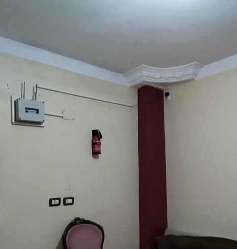 a room with a fire hydrant on the wall at Blue Horizon Homestay -FOR MEN ONLY- in Dumyāţ al Jadīdah