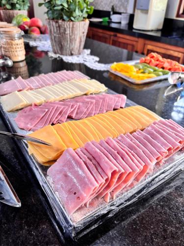 a bunch of different types of meats on a counter at Recanto da Natureza in Brotas