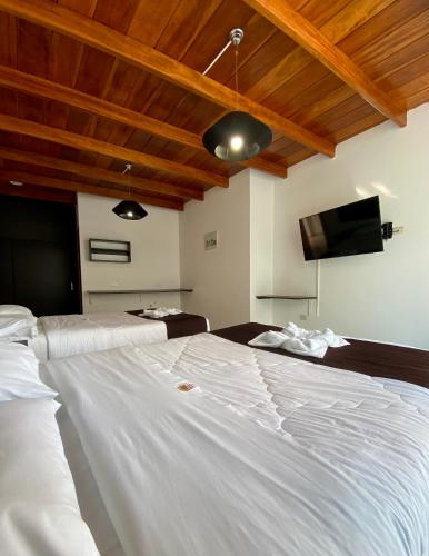 Ένα ή περισσότερα κρεβάτια σε δωμάτιο στο Mochican Palace Hotel