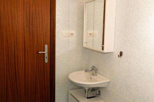 a bathroom with a sink and a medicine cabinet at Casa Carrella in Salerno