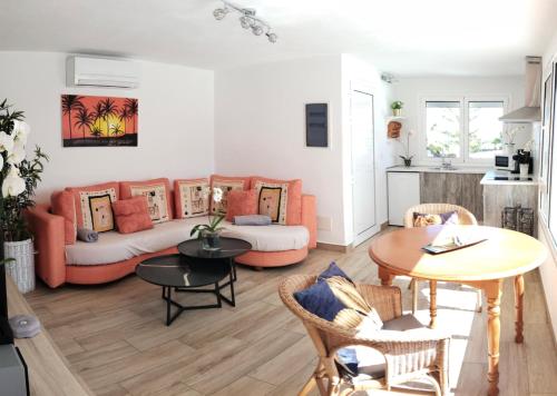 a living room with a couch and a table at Apartamento Via Mare in Puerto del Carmen