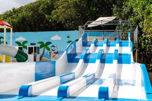 a water park with a slide in a pool at Grand Sirenis Riviera Maya Resort & Spa All Inclusive in Akumal