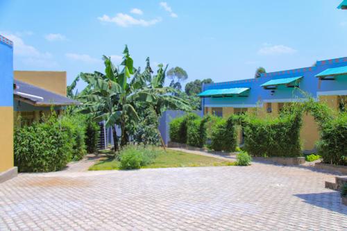 a brick driveway in front of a building at Kisoro Comfort Inn in Kisoro