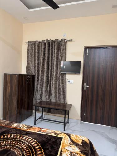 TV a/nebo společenská místnost v ubytování Hotel Green Leaf