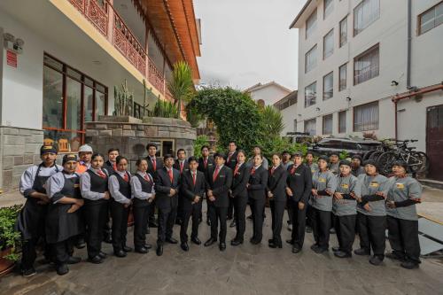 a group of people standing in front of a building at Quechua Hotel Cusco in Cusco