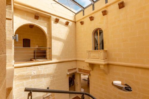 a bathroom with a mirror and a glass ceiling at OneFifty Gozitan Villa and Pool in Il-Pergla