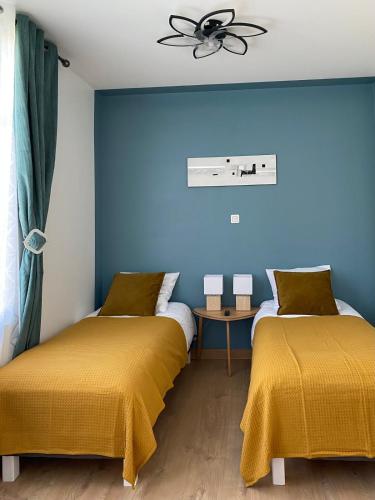 Postel nebo postele na pokoji v ubytování L'Espérance vue sur la vigne et la Loire