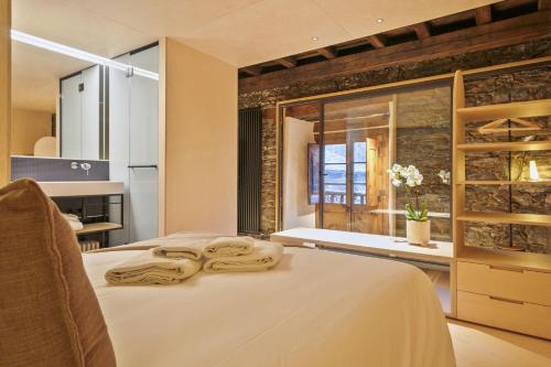 Ένα ή περισσότερα κρεβάτια σε δωμάτιο στο Luderna - Casa Mas de la Costa
