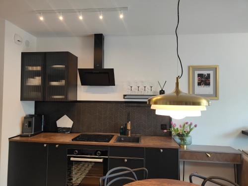 Η κουζίνα ή μικρή κουζίνα στο Apartament N7 Centrum