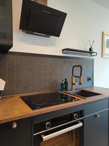 Η κουζίνα ή μικρή κουζίνα στο Apartament N7 Centrum