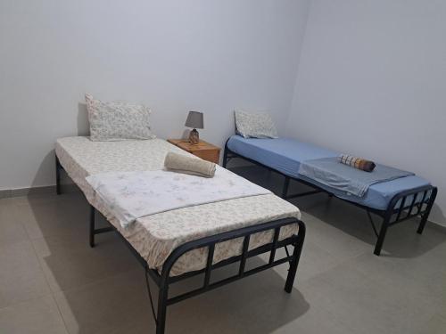 Postel nebo postele na pokoji v ubytování Barros Homestay