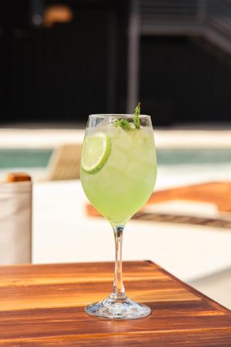 a drink in a glass with a lime in it at Wao Beach Venao in Playa Venao