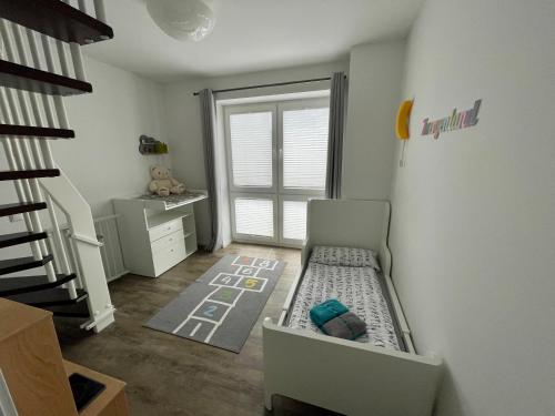 En eller flere senge i et værelse på Ferienhaus Villa Wunderbar Dangast im Nordsee Park am Jadebusen