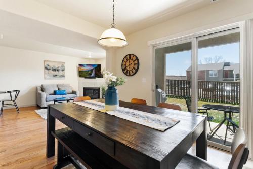 a living room with a table and a couch at Executive Townhouse To Stay in Colorado Springs