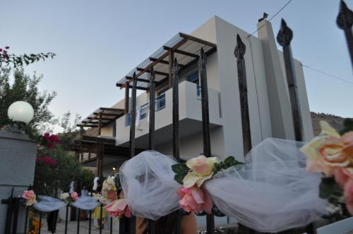 a bunch of flowers on a fence in front of a building at Villa Amor in Pefki Rhodes