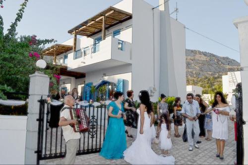 a group of people standing in front of a fence at Villa Amor in Pefki Rhodes