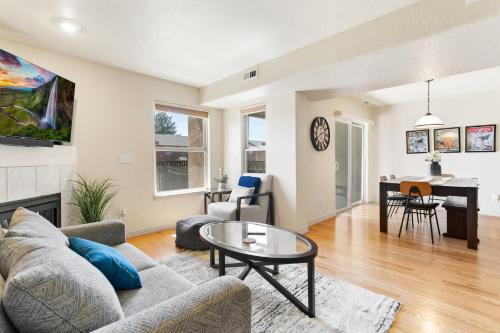 a living room with a couch and a table at Executive Townhouse To Stay in Colorado Springs