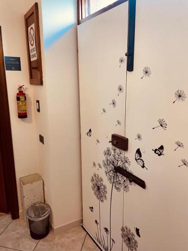 a room with a door with butterflies on the wall at La casa dei nonni in San Salvo