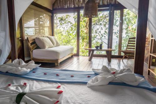 a bedroom with a bed with flowers on the floor at El Pital, Chocolate Paradise in Balgue
