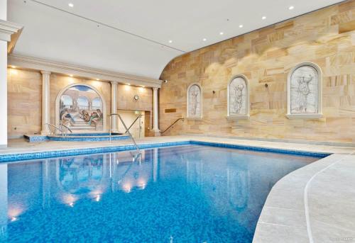 a swimming pool in a building with a pool at QV Stays Luxury Suite with Views Galore in Auckland