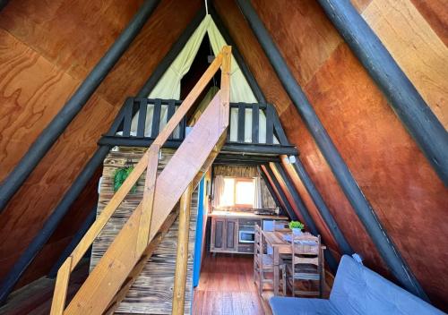 an overhead view of a staircase in a tiny house at Hotel Guerra - Pousada Montebelo in Jaguaruna