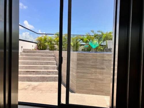 a view of stairs from a window of a building at Central Playa del Carmen Master Suite with rooftop pool and gym WiFi free parking near beach in Playa del Carmen