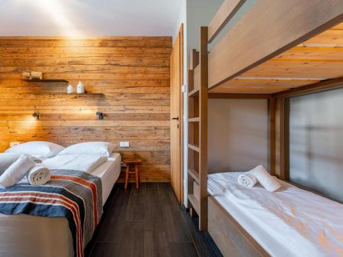 Ένα ή περισσότερα κρεβάτια σε δωμάτιο στο Chalet Schneelöwe L