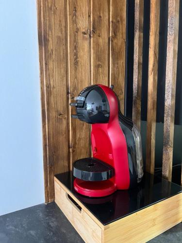 a red mixer sitting on top of a table at Apartment with the pool in Moncófar