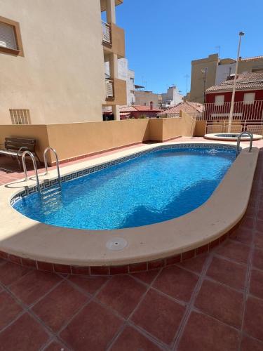 a swimming pool on the side of a building at Apartment with the pool in Moncófar