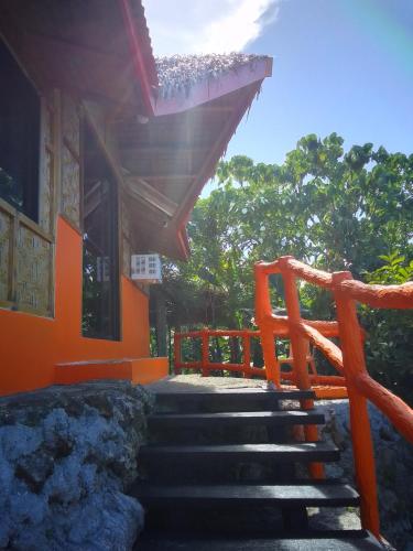 a set of stairs leading to a building at Grotto Gardens Homestay in San Isidro