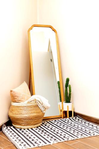 a mirror sitting on a floor next to a rug at Life Hospitality in Ensenada