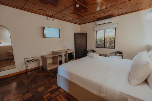 Postel nebo postele na pokoji v ubytování Hotel Boutique Rebequet