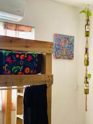 a bunk bed with a pillow on top of it at Casa Semilla in Holbox Island