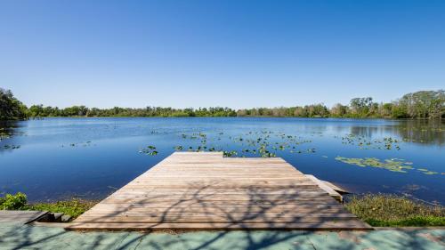 a dock in the middle of a lake at Lakefront Retreat - Boat - Fish - Close to all Orlando Parks - Disney - Universal - SeaWorld in Orlando