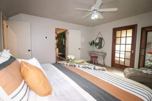 a bedroom with a bed and a ceiling fan at Villa MiaNova A Modern Hideout in the Woods in Lake Ariel