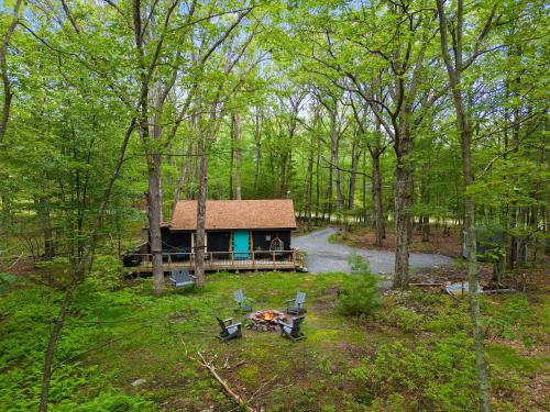 an aerial view of a cabin in the woods at Perfect Couples Cabin Fireplace Firepit & Wine Nearby in Hawley