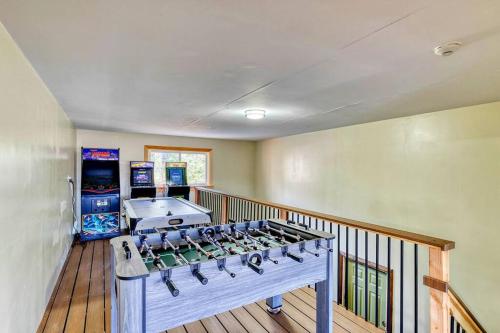 a large room with a video game system on a balcony at Hot Tub Sauna Steam Room Arcades Airhockey in East Stroudsburg