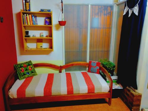 a childs bedroom with a bed and a book shelf at Dpto BBB in Zapala