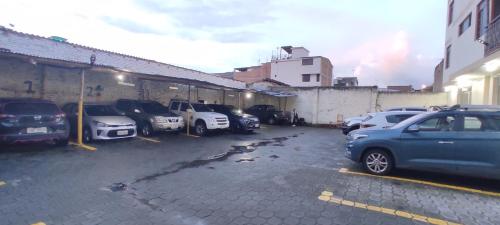 a bunch of cars parked in a parking lot at Hotel LaJoya in Otavalo